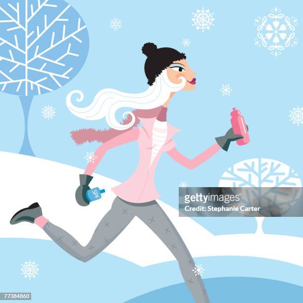 a woman jogging in the winter - jogging winter stock-grafiken, -clipart, -cartoons und -symbole