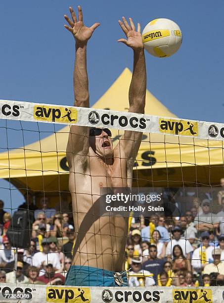 Jake Gibb tries to block the ball during the men's finals against Matt Fuerbringer andf Casey Jennings in the AVP San Francisco Best of the Beach at...