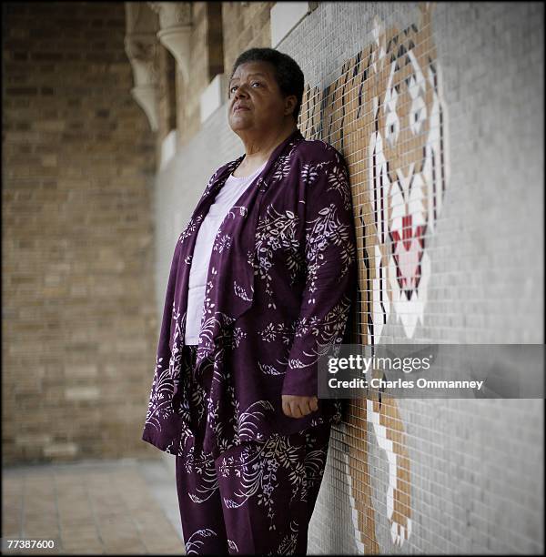 Elizabeth Eckford poses for a portrait on September 13, 2007 in front of the main entrance of Central High School in Little Rock, Arkansas. Threading...