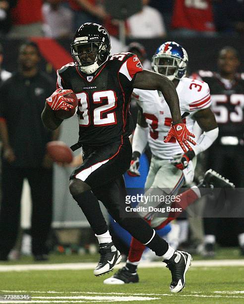 Running back Jerious Norwood of the Atlanta Falcons breaks free for a long touchdown run in the first half while taking on the New York Giants at...