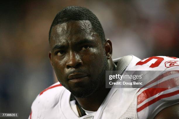 Defensive end Justin Tuck of the New York Giants sits on the bench late in the game against the Atlanta Falcons at Georgia Dome on October 15, 2007...