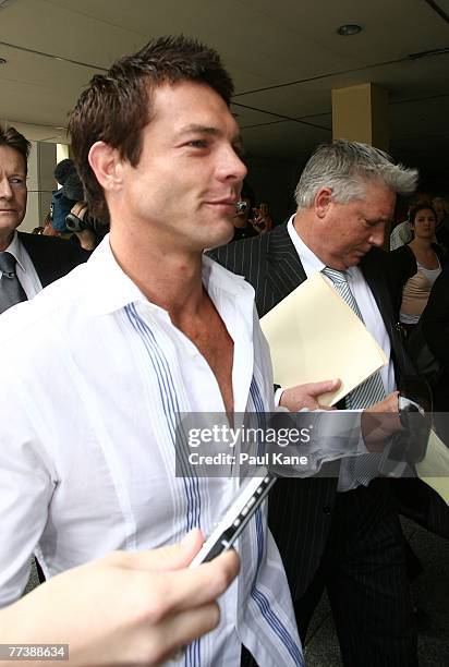 Former West Coast Eagles AFL player Ben Cousins and his lawyer Shane Brennan leave the Perth Magistrates Court after facing drug possession charges...