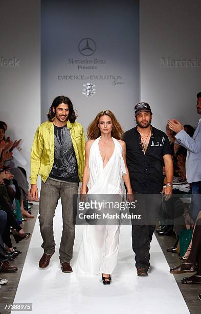 Designers Ali Alborzi and Andrew McCarthy walk the runway with a model at the Evidence Of Evolution Spring 2008 fashion show during Mercedes Benz...