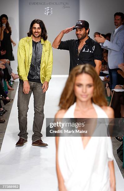 Designers Ali Alborzi and Andrew McCarthy walk the runway with a model at the Evidence Of Evolution Spring 2008 fashion show during Mercedes Benz...