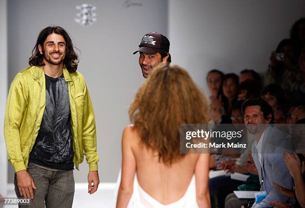 Designers Ali Alborzi and Andrew McCarthy walk the runway with a model at the Evidence Of Evolution Spring 2008 fashion show during Mercedes Benz...