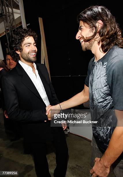 Designer Ali Alborzi and actor Adrian Grenier backstage at the Evidence Of Evolution Spring 2008 fashion show during Mercedes-Benz Fashion Week held...