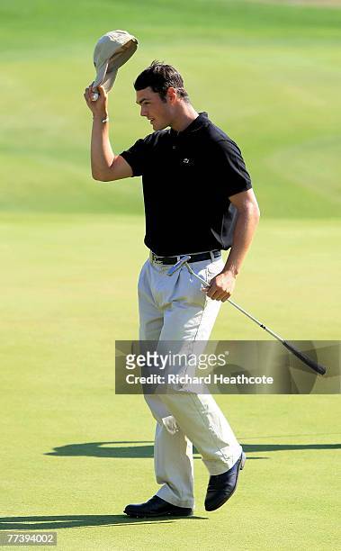 Martin Kaymer of Germany reacts to a birdie putt on the 18th green during the first round of the Portugal Masters at Oce?nico Victoria Clube de Golfe...