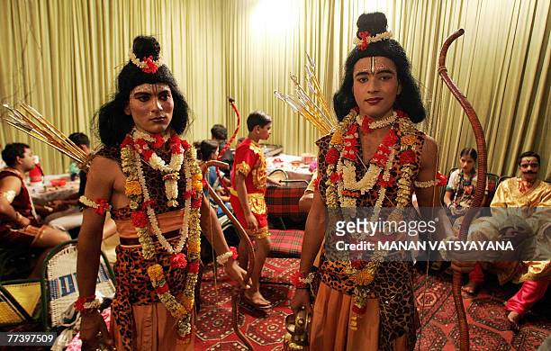 Indian actors dressed as Lord Rama and Lord Laksmana wait for their turn during Ramleela at the Sri Dharmik Ramleela committee in New Delhi, 18...