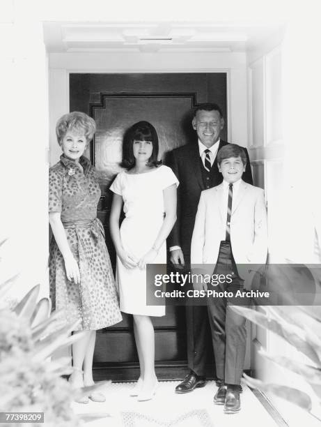 Portrait of American actress and comedienne Lucille Ball and her family, daughter Lucie Arnaz, son Desi Arnaz Jr, and husband comedian Gary Morton ,...