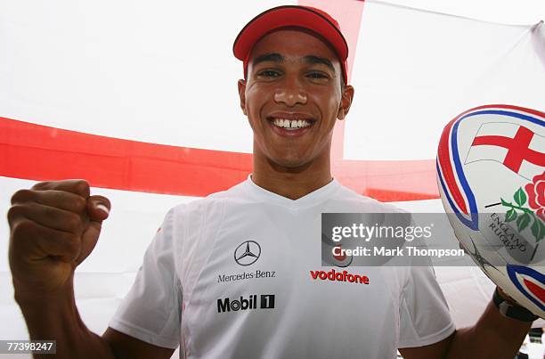 Lewis Hamilton of Great Britain and McLaren Mercedes looks forward to the Rugby World Cup Final between England and South Africa during previews...