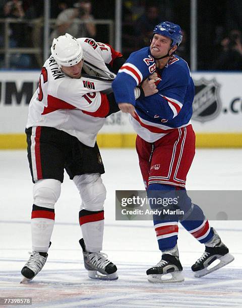 Brian McGrattan of the Ottawa Senators and Colton Orr of the New York Rangers fight during the second period during their game at Madison Square...