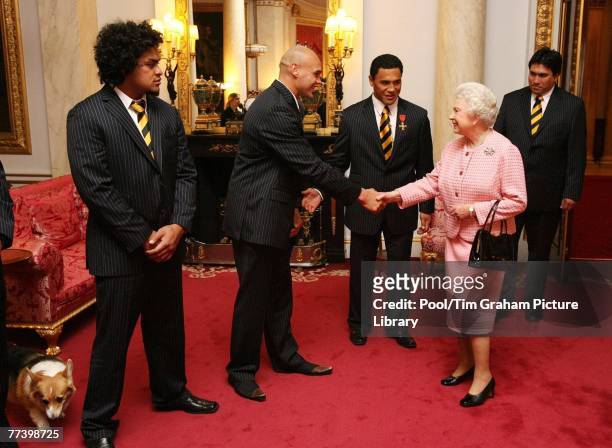 Queen Elizabeth II is introduced to members of the New Zealand Rugby League Team, the All Golds, by their captain Ruben Wiki , inside the Bow Room at...