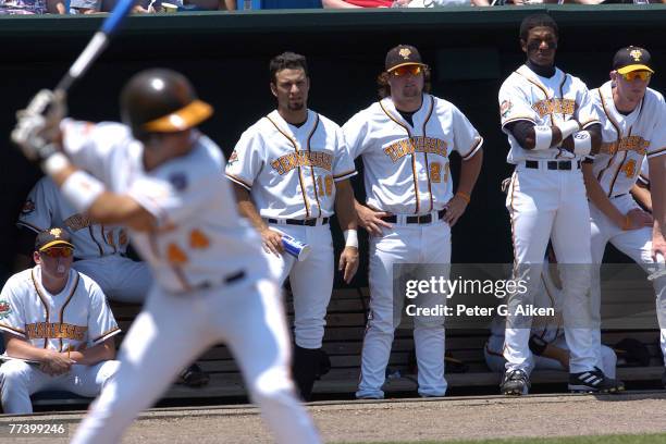 Tennessee players Alex Suarez, Kyle McCulloch, Julio Borbon and Todd Gilfillan look on from the dugout as J. P. Arencibia bats in the bottom of the...