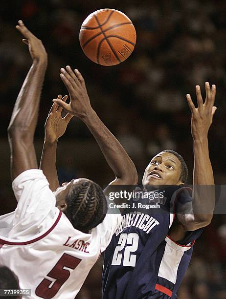 University of Massachusetts' Stephane Lasme, left, battles Rudy Gay of the University of Connecticut, Thursday, December 9 in Amherst, Massachusetts....