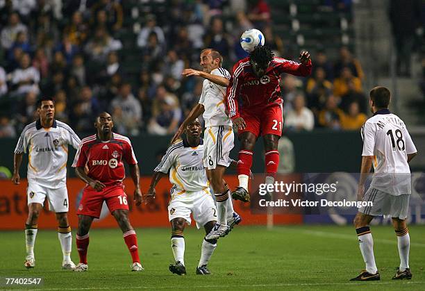 Peter Vagenas of the Los Angeles Galaxy vies for the high ball with Collin Samuel of Toronto FC at midfield during their MLS match at the Home Depot...