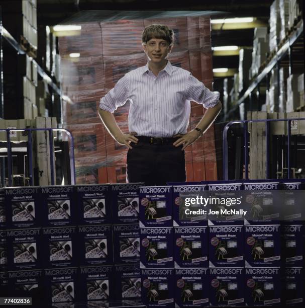 Microsoft owner and founder Bill Gates poses in front of hundreds of boxed Microsoft products in 1986 at the packaging facility in the new 40-acre...