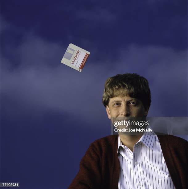 Microsoft owner and founder Bill Gates poses with a hovering floppy disk in 1986 at the new 40-acre corpororate campus in Redmond, Washington. In...