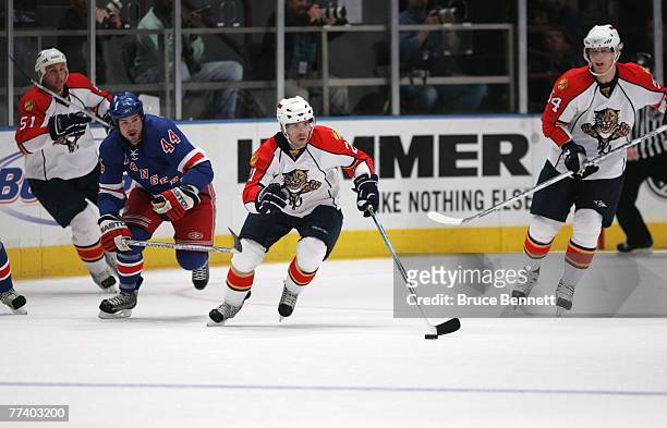 Playing in his first NHL game, Cory Murphy of the Florida Panthers skates against the New York Rangers on October 4, 2007 at Madison Square Garden in...