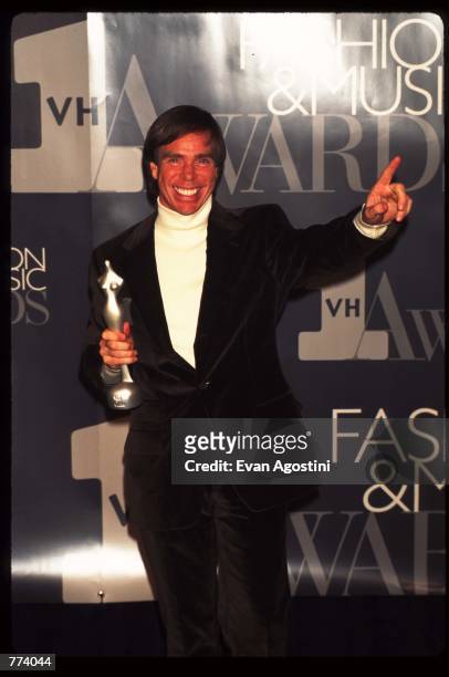 Fashion Designer Tommy Hilfiger holds his statue for Catwalk to Sidewalk at the 1995 VH1 Fashion and Music Awards December 3, 1995 in New York City....