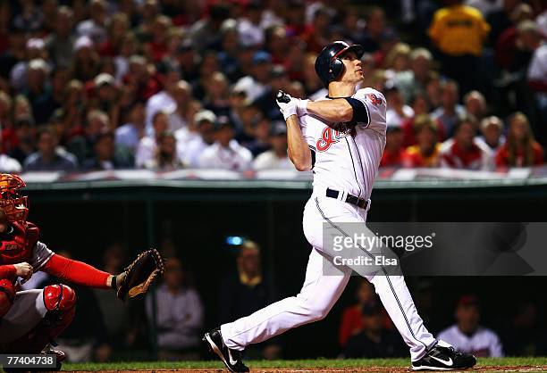 Grady Sizemore of the Cleveland Indians hits a double in the first inning against the Boston Red Sox during Game Five of the American League...