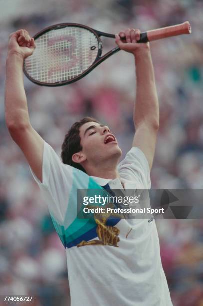 American tennis player Pete Sampras raises his arms in the air in celebration after beating Andre Agassi 6-4, 6-3, 6-2 in the final of the Men's...