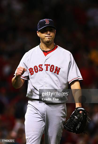 Starting pitcher Josh Beckett of the Boston Red Sox celebrates after closing the eighth inning against the Cleveland Indians during Game Five of the...