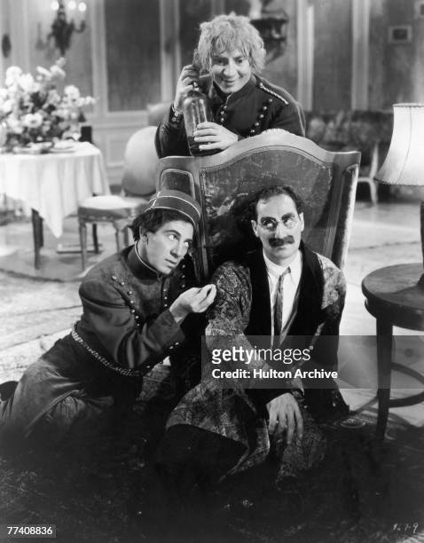 Harpo Marx , Groucho Marx and Chico Marx in a scene from the comedy 'A Day at the Races', directed by Sam Wood, 1937.