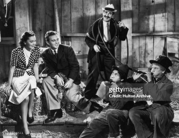 Maureen O'Sullivan , Allan Jones , Groucho Marx , Chico Marx and Harpo Marx in a scene from the Marx Brothers comedy 'A Day at the Races', directed...