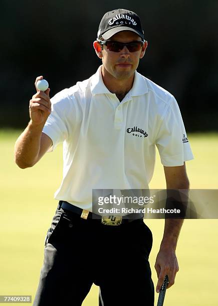 Charl Schwartzel of South Africa reacts to a birdie putt on the 18th green during the second round of the Portugal Masters at Oce?nico Victoria Clube...