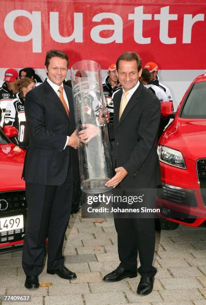 Michael Renz , Audi Marketing and member of the board, and Alfons Hoermann, President of the DSV German Ski Association, pose after a press...