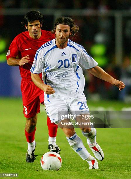 Ioannis Amanatidis of Greece battles with Turkey defender Ibrahim Uzulmez during the Euro 2008 Qualifying match between Turkey and Greece at Ali Sami...