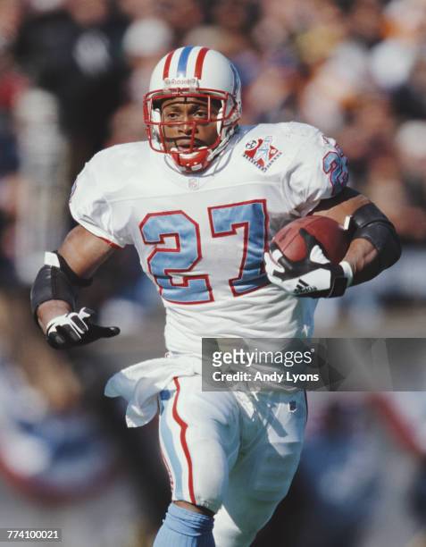 Eddie George, Running Back for the Tennessee Titans runs the ball during the American Football Conference Central game against the Minnesota Vikings...