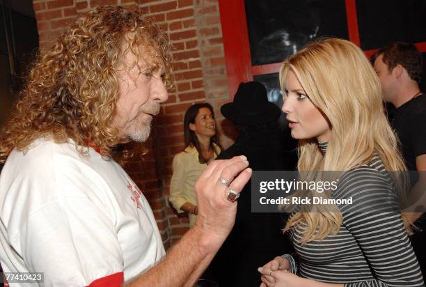 Singer/Songerwriter Robert Plant of Led Zeppelin chats with Singer/Actress Jessica Simpson backstage after the taping of CMT's Crossroads with Robert...