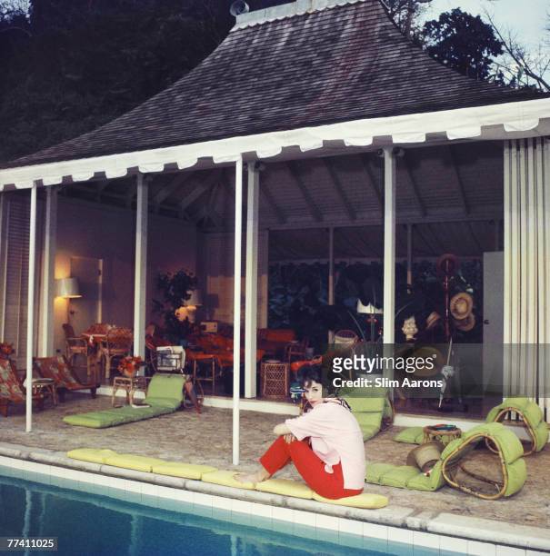 American socialite Babe Paley , the wife of CBS radio executive William S. Paley, beside the pool at Round Hill, their villa in Jamaica, 1959.