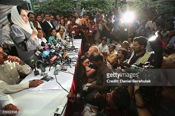 Former Prime Minister Benazir Bhutto addresses members of the media at a press conference on October 19, 2007 in Karachi, Pakistan. Bhutto condemned...