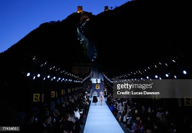 Models walk the runway with designer Karl Lagerfeld's Fall/Winter 2007 collection at the Fendi Great Wall of China fashion show taking place on the...