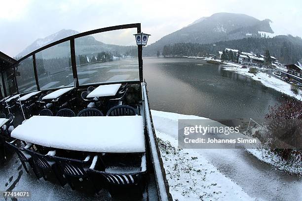 Snow covers the tables of a restaurant in front of the Spitzingsee Lake on October 19, 2007 in Spitzingsee, Germany. Weather forecasts predict more...
