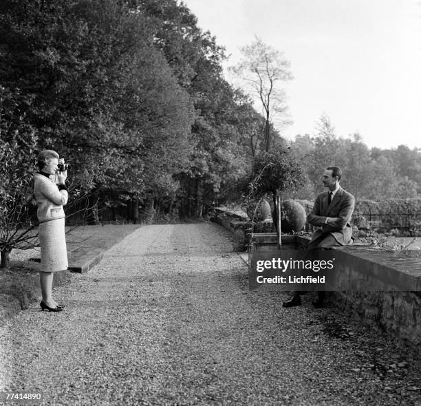 Grand Duchess Josephine-Charlotte photographing HRH Grand Duke Jean of Luxembourg at home in the grounds of the Grand Ducal Palace on 13th October...