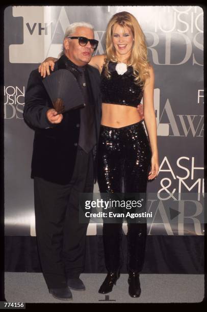 Designer Carl Lagerfeld stands next to model Claudia Schiffer at the 1995 VH1 Fashion and Music Awards December 3, 1995 in New York City. The awards...