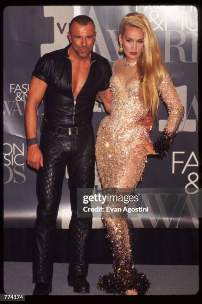 Designer Thierry Mugler stands with model Jerry Hall at the 1995 VH1 Fashion and Music Awards December 3, 1995 in New York City. The awards show...