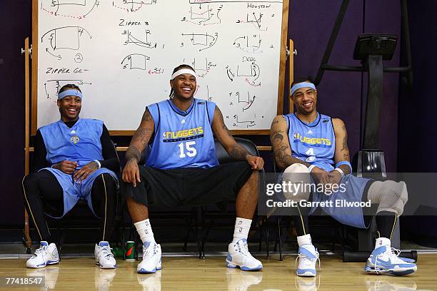 Allen Iverson, Carmelo Anthony and Kenyon Martin of the Denver Nuggets share a laugh during practice on October 19, 2007 at the Pepsi Center in...