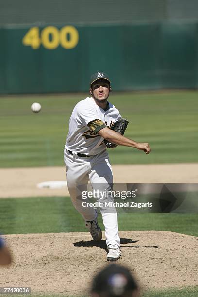 Huston Street of the Oakland Athletics pitches during the game against the Kansas City Royals at the McAfee Coliseum in Oakland, California on August...