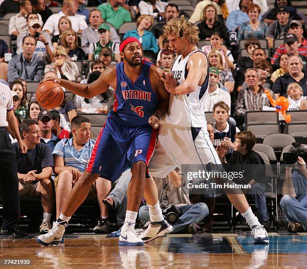 Rasheed Wallace of the Detroit Pistons backs in against Dirk Nowitzki of the Dallas Mavericks at the American Airlines Center October 19, 2007 in...