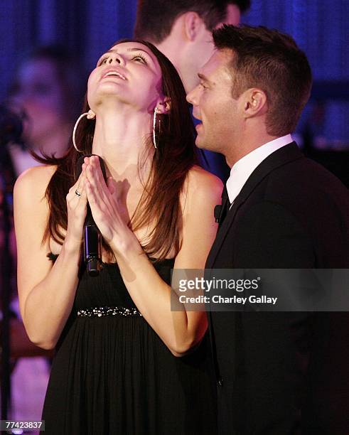 Singer Katharine McPhee and television personality Ryan Seacrest perform at the 53rd Annual Young Musicians Foundation Gala, celebrating Merv...