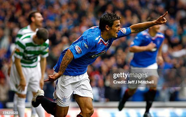 Nacho Novo of Rangers celebrates after scoring against Celtic during the Scottish Premier League match between Rangers and Celtic at Ibrox Stadium on...