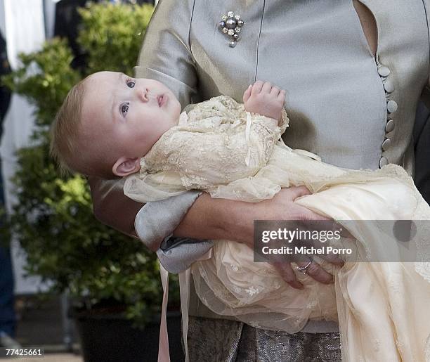 Dutch Princess Ariane is carried by her mother Princess Maxima as they arrive at the Kloosterkerk for her christening ceremony in The Hague on...