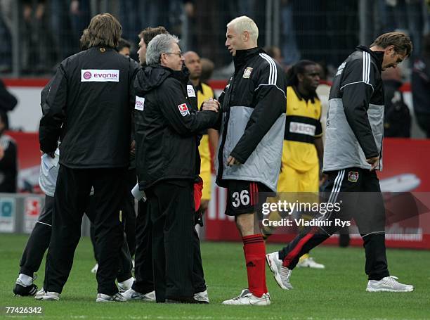 Sergej Barbarez of Leverkusen shakes hand with press officer Josef Schneck of Dortmund after the end of the Bundesliga match between Bayer Leverkusen...