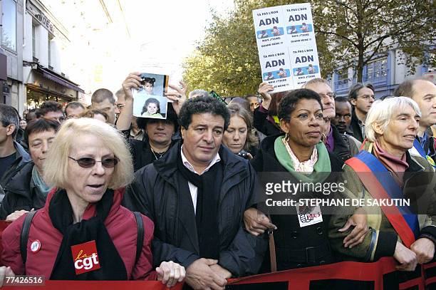 French MRAP President Mouloud Aounit and Socialist Paris PM George Pau-Langevin demonstrate in Paris 20 October 2007 in a protest called by severql...