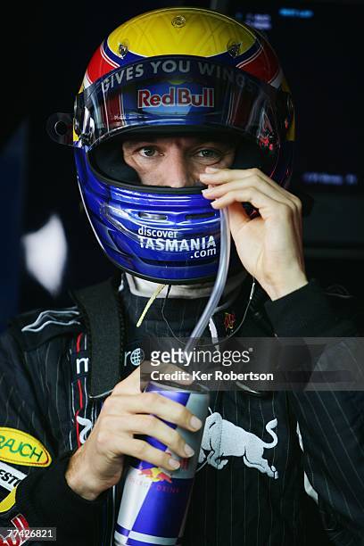 Mark Webber of Australia and Red Bull Racing is seen in his team garage during qualifying for the Brazilian Formula One Grand Prix at the Autodromo...