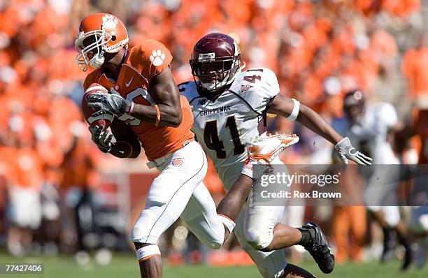 Aaron Kelly of the Clemson Tigers pulls in a catch in front of Thomas "Red" Keith of the Central Michigan Chippewas for a touchdown at Memorial...